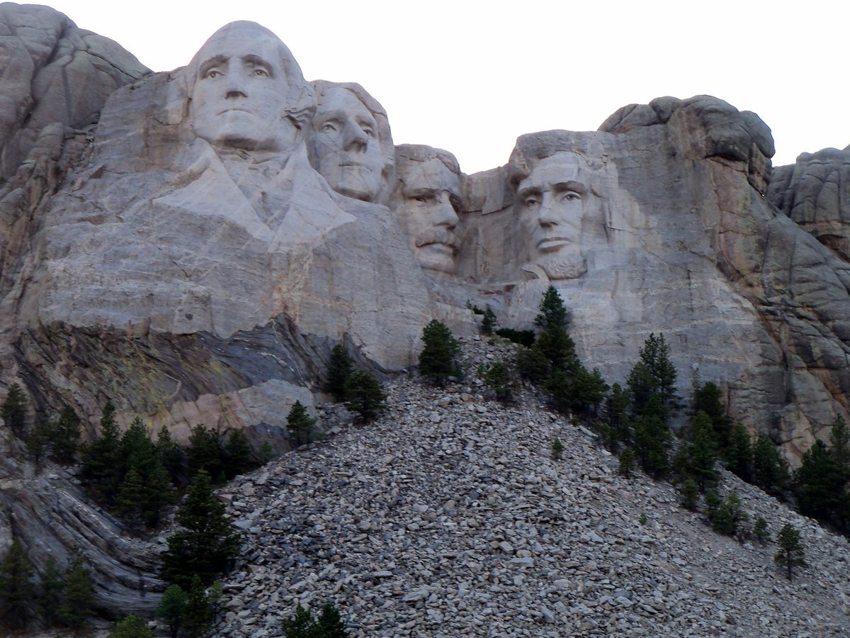 Mount Rushmore National Memorial framed by pine trees