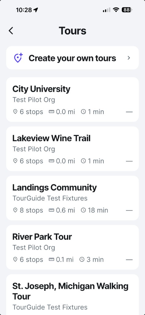 The Tours list in the USTourGuide app: Create your own tours, plus nearby tour cards with stops, distance, and time